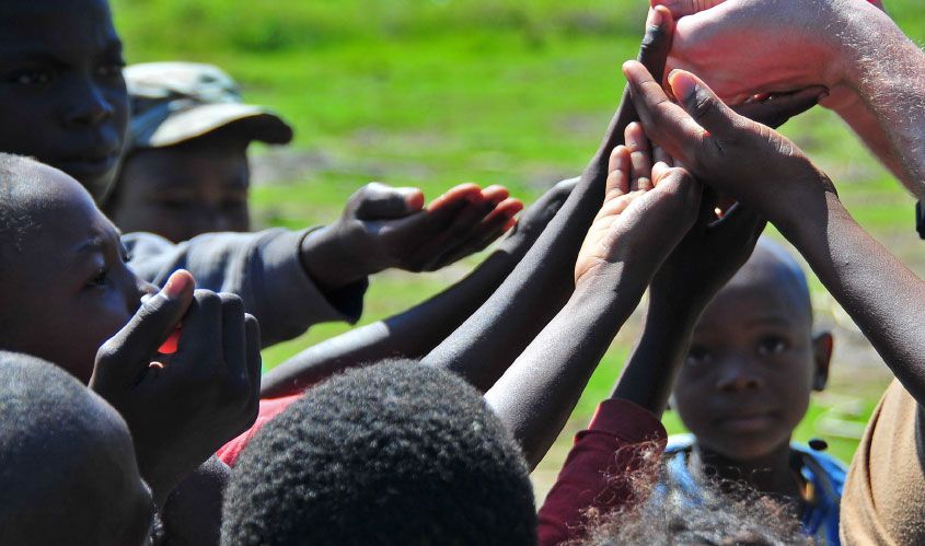 Hands Held Up to Receive Hands Held Up to Receive